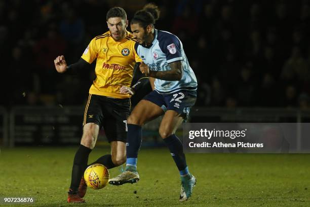 Ben Tozer of Newport County is challenged by Josh Lelan of Crawley Town during the Sky Bet League Two match between Newport County and Crawley Town...