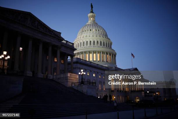 The U.S. Capitol is seen as lawmakers work to avert a government shutdown January 19, 2018 in Washington, DC. A continuing resolution to fund the...