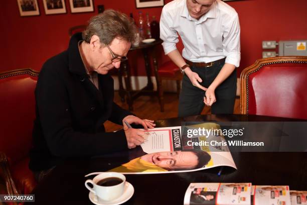 Bryan Cranston signing guest book and posters at The Cambridge Union on January 19, 2018 in Cambridge, Cambridgeshire.