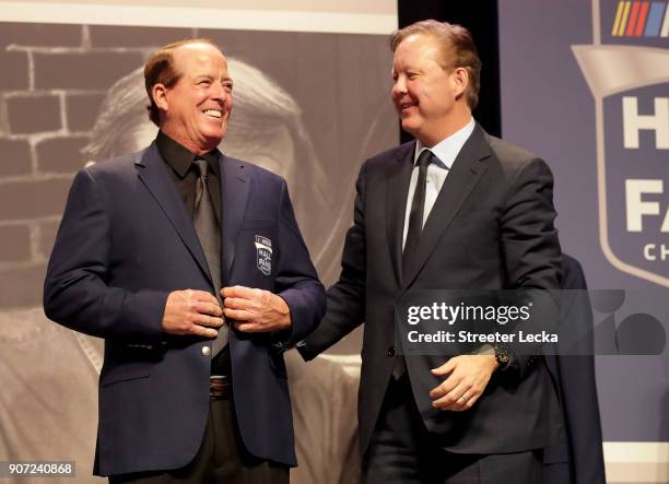 Chief Executive Officer and Chairman, Brian France, presents Ron Hornaday Jr. With his Hall of Fame jacket during a banquet before the NASCAR Hall of...