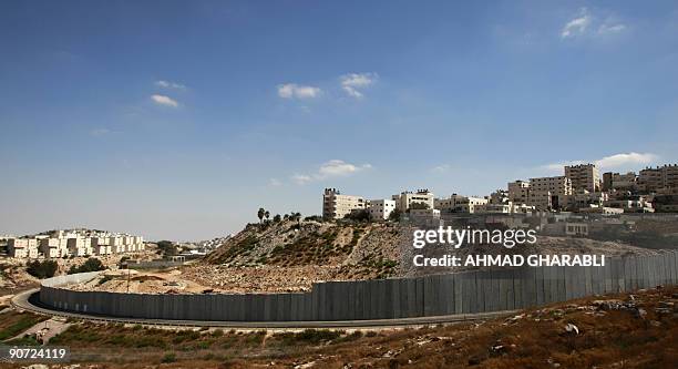 Israel's controversial barrier separates the Jewish settlement of Pisgat Zeev and the Palestinian neighbourhood of Anata in east Jerusalem on...