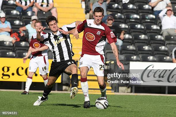 Luke Boden of Northampton Town contests the ball with Johnnie Jackson of Notts County during the Coca Cola League Two match between Notts County and...