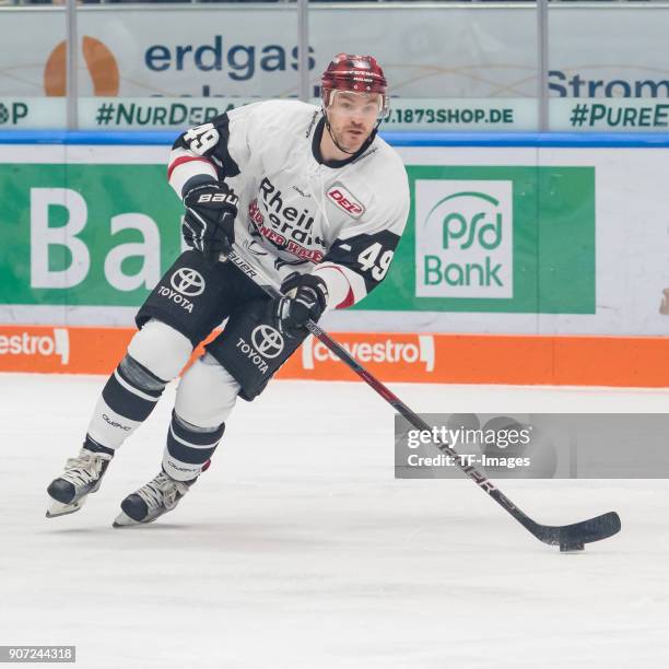 Alexandre Bolduc of Koelner Haie controls the ball during the DEL match between Augsburger Panther and Koelner Haie at Curt-Frenzel-Stadion on...