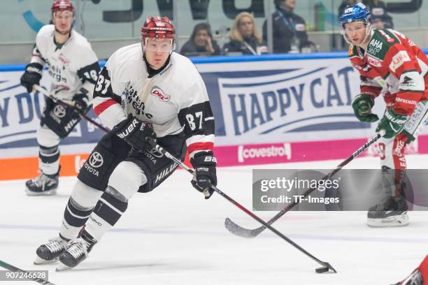 Philip Gogulla of Koelner Haie controls the ball during the DEL match between Augsburger Panther and Koelner Haie at Curt-Frenzel-Stadion on January...