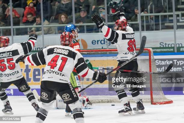 Felix Schuetz of Koelner Haie, Justin Shugg of Koelner Haie and Ben Hanowski of Koelner Haie celebrate their team`s second goal during the DEL match...