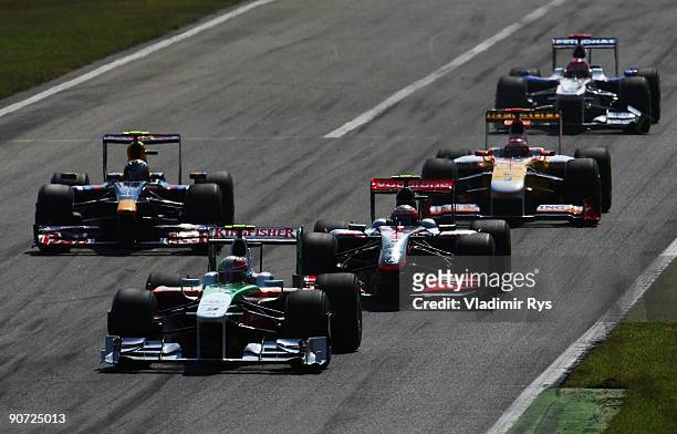 Vitantonio Liuzzi of Italy and Force India leads a group of cars during the Italian Formula One Grand Prix at the Autodromo Nazionale di Monza on...