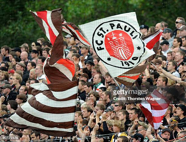 Fans of St. Pauli celebrate during the 2. Bundesliga match between FSV Frankfurt and FC St. Pauli at the Volksbank stadium on September 13, 2009 in...