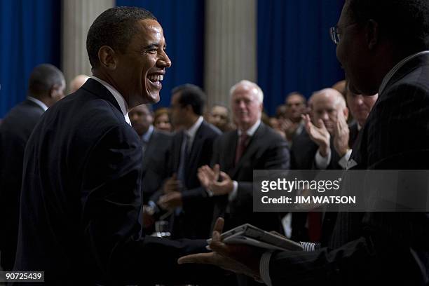 President Barack Obama shakes hands with the crowd after delivering a major speech on the finacial crisis at Federal Hall in New York, NY, September...