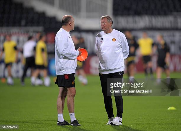 Sir Alex Ferguson the Manchester United manager with assistant Mike Phelan during training at the Inonu Stadium ahead on tomorrows UEFA Champions...