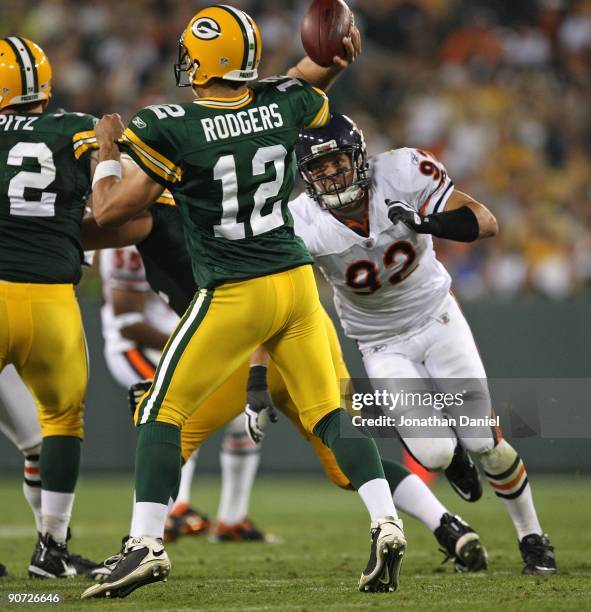 Hunter Hillenmeyer of the Chicago Bears rushes Aaron Rodgers of the Green Bay Packers on September 13, 2009 at Lambeau Field in Green Bay, Wisconsin....