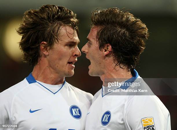 Matthias Langkamp of Karlsruhe jubilates with his team mate Sebastian Langkamp after scoring the first goal during the Second Bundesliga match...