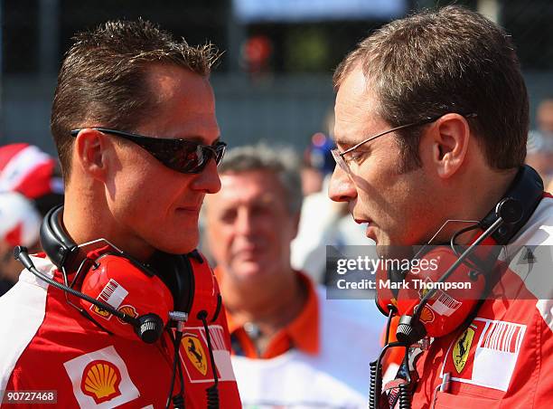 Former Ferrari F1 World Champion Michael Schumacher talks with Ferrari Sporting Director Stefano Domenicali before the Italian Formula One Grand Prix...