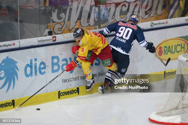 Jerome Flaake of Red Bull Munich vies Marco Nowak of Duesseldorfer EG during the 43th game day of the German Ice Hockey League between Red Bull...