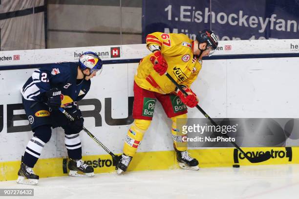Dominik Kahun of Red Bull Munich vies Bernhard Ebner of Duesseldorfer EG during the 43th game day of the German Ice Hockey League between Red Bull...