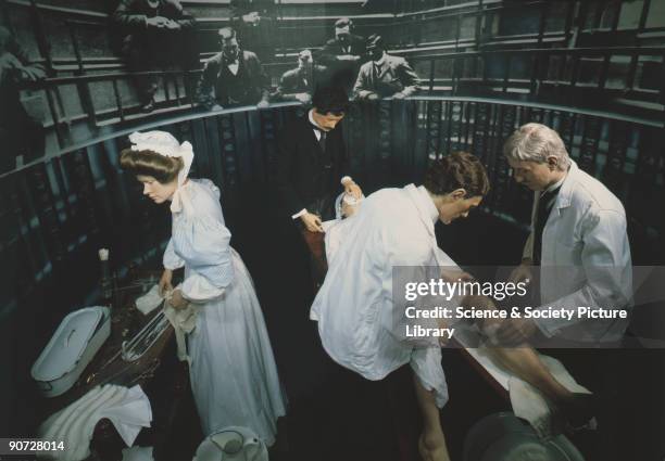 Lifesize reconstruction in the Lower Wellcome Gallery, Science Museum, London. This diorama shows surgeons preparing to carry out an amputation by...