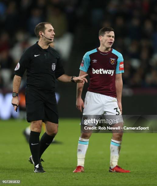 West Ham United's Josh Cullen has a disagreement with referee Jeremy Simpson during The Emirates FA Cup Third Round Replay match between West Ham...