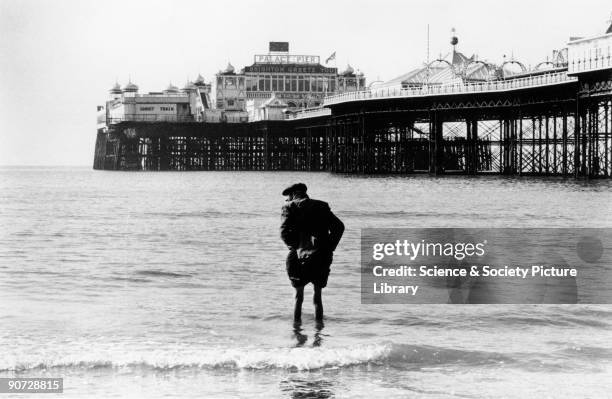 Taken near the Palace Pier at Brighton, West Sussex. Photographer Tony Ray-Jones created most of his images of the British at work and leisure...