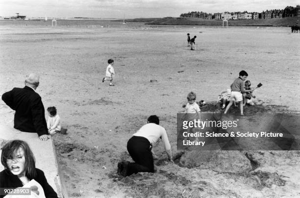 Taken at Margate, Kent. Photographer Tony Ray-Jones created most of his images of the British at work and leisure between 1966 and 1969. Travelling...