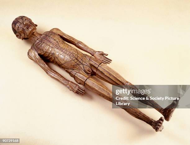 This wooden figure of a man nearly a metre tall was used in acupuncture teaching in China. Acupuncture is a medical technique which has been...