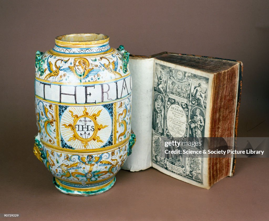 Albarello drug jar, Italian, 1641, and a copy of �Gerarde�s Herball�, 1633.