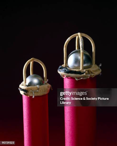 Artificial mitral and aortic valves used to replace natural valves that have failed due to mitral stenosis. The valves are shown attached to tubes to...