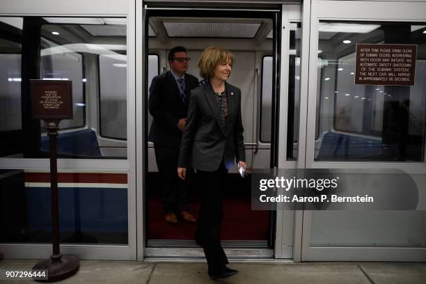 Sen. Tina Smith walks to a Democratic Caucus meeting at the U.S. Capitol January 19, 2018 in Washington, DC. A continuing resolution to fund the...