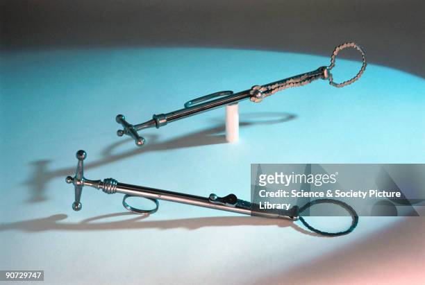 The castration device in the foreground is a steel ecraseur, manufactured by Evans & Co of London between 1867-1900. The device in the background is...