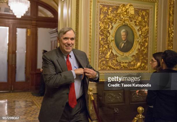 Senatot Jeff Merkley walks to a Democratic Caucus meeting at the US Capitol on January 19, 2018 in Washington, DC. A continuing resolution to fund...