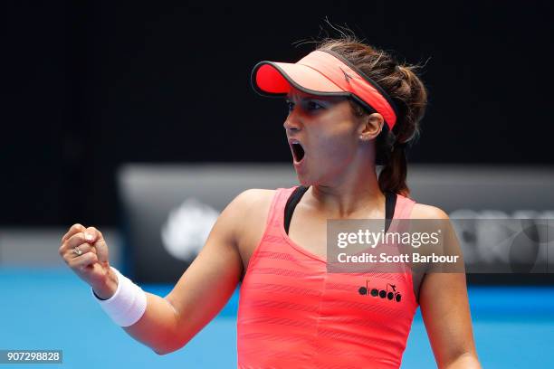 Lauren Davis of the United States celebrates winning a point in her third round match against Simona Halep of Romania on day six of the 2018...