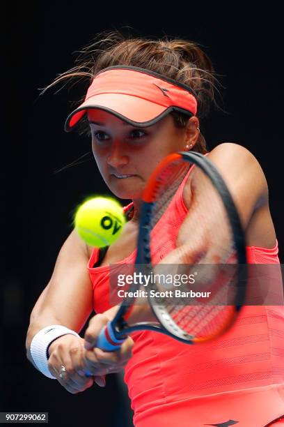 Lauren Davis of the United States plays a backhand in her third round match against Simona Halep of Romania on day six of the 2018 Australian Open at...