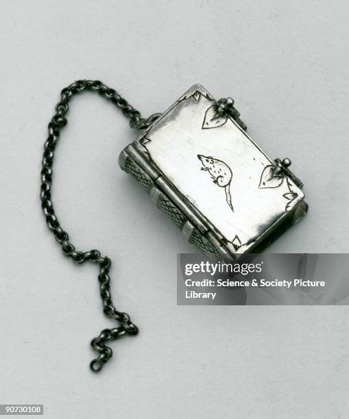 This pomander, with a rat engraved on its side, contains six compartments and has a chain for suspension. It was probably carried as a protector...