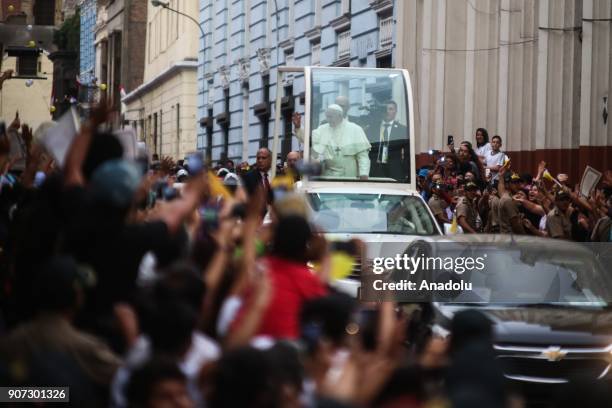 Pope Francis greets the crowd during his departure from the Government Palace after his meeting with Peruvian President, Pedro Pablo Kuczynski in...