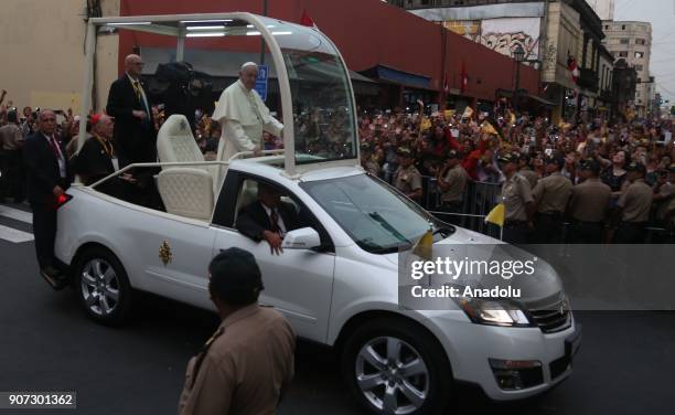 Pope Francis greets the crowd during his departure from the Government Palace after his meeting with Peruvian President, Pedro Pablo Kuczynski in...