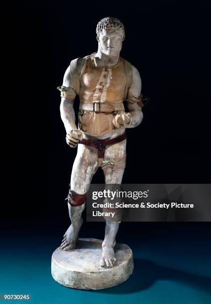 Plaster model of a male figure in classical style, wearing several miniature orthopaedic appliances, including a truss and corset. Braces and trusses...