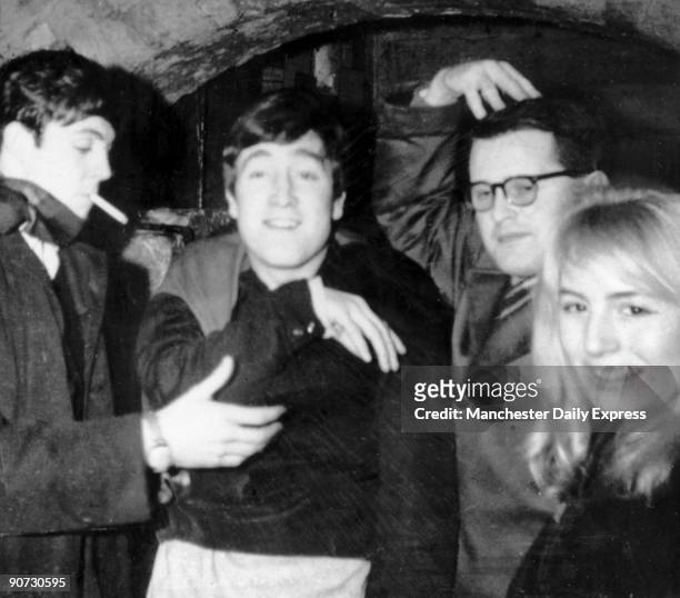 October 1962: John Lennon with Cynthia Lennon at the Cavern Club. Before being signed to Parlophone in 1962 The Beatles were found playing in the...