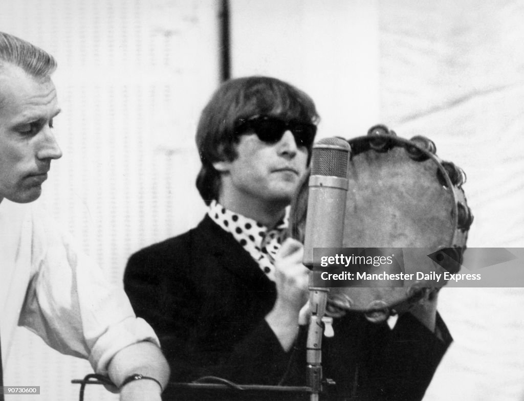 Beatle John Lennon with record producer George Martin, 2 October 1964.