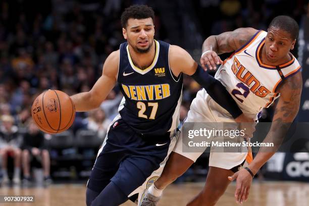 Jamal Murray of the Denver Nuggets drives against Isaiah Canaan of the Phoenix Suns at the Pepsi Center on January 19, 2018 in Denver, Colorado. NOTE...