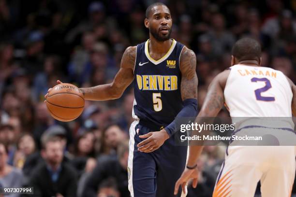 Will Barton of the Denver Nuggets brings the ball down the court against Isaiah Canaan of the Phoenix Suns at the Pepsi Center on January 19, 2018 in...