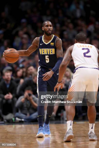 Will Barton of the Denver Nuggets brings the ball down the court against Isaiah Canaan of the Phoenix Suns at the Pepsi Center on January 19, 2018 in...