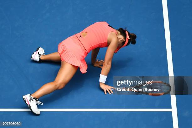 Lauren Davis of the United States injures her foot in a fall in her third round match against Simona Halep of Romania on day six of the 2018...