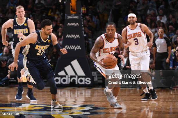 Isaiah Canaan of the Phoenix Suns handles the ball against the Denver Nuggets on January 19, 2018 at the Pepsi Center in Denver, Colorado. NOTE TO...