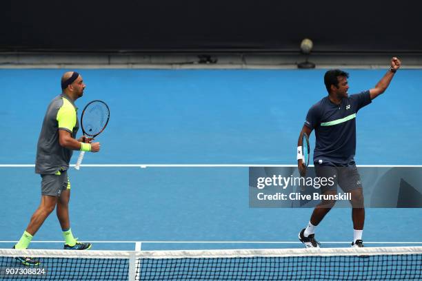 Purav Raja of India and Leander Paes of India celebrates winning a point in their second round men's doubles match against Jamie Murray of Great...