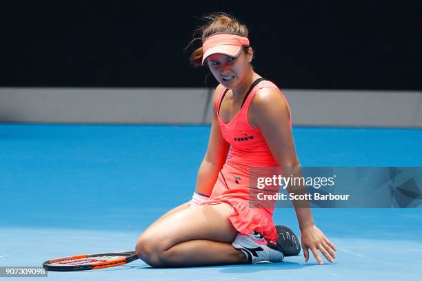 Lauren Davis of the United States falls in her third round match against Simona Halep of Romania on day six of the 2018 Australian Open at Melbourne...