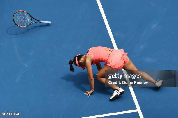 Lauren Davis of the United States falls in her third round match against Simona Halep of Romania on day six of the 2018 Australian Open at Melbourne...