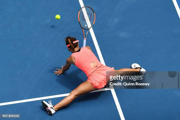 Lauren Davis of the United States falls in the third set of her third round match against Simona Halep of Romania on day six of the 2018 Australian...