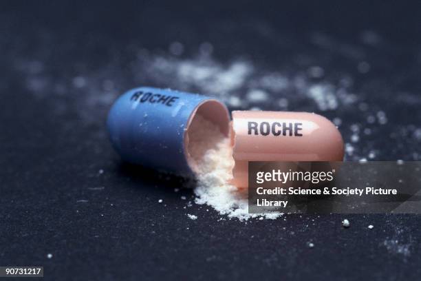 Capsule manufactured by Roche. Drug capsules of this type were invented by the American drugs manufacturer Eli Lilly. The drug to be taken is...