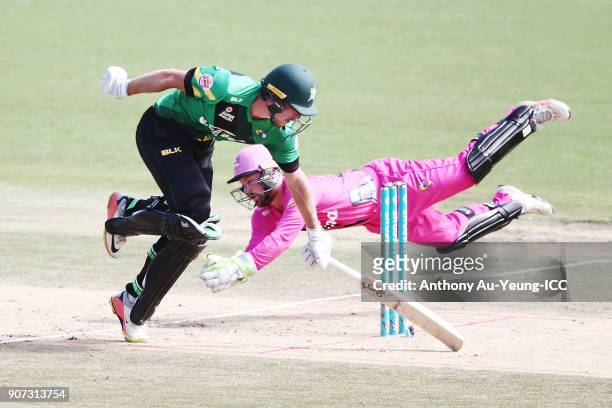 George Worker of the Stags makes his ground as Tim Seifert of the Knights goes for the run out during the Super Smash Grand Final match between the...