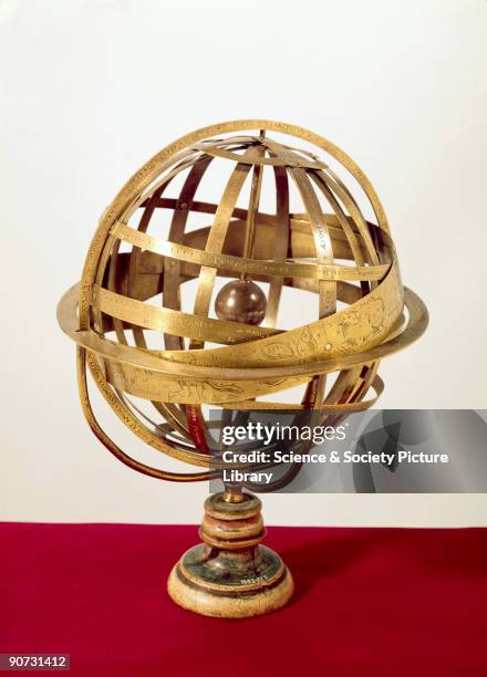 Made by Caspar Vopel in Cologne, Germany, this brass armillary sphere is mounted on a turned wooden stand. A broad band, finely engraved with the...