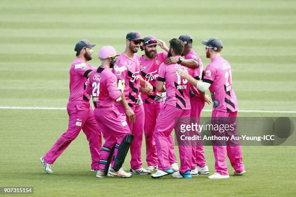 Dean Brownlie of the Knights celebrates with teammates for the wicket of George Worker of the Stags during the Super Smash Grand Final match between...