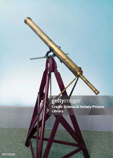 Made by the London instrument maker Charles Tulley, this brass telescope has a 3 1/4 inch aperture lens and is mounted on a yoke stand with braced...